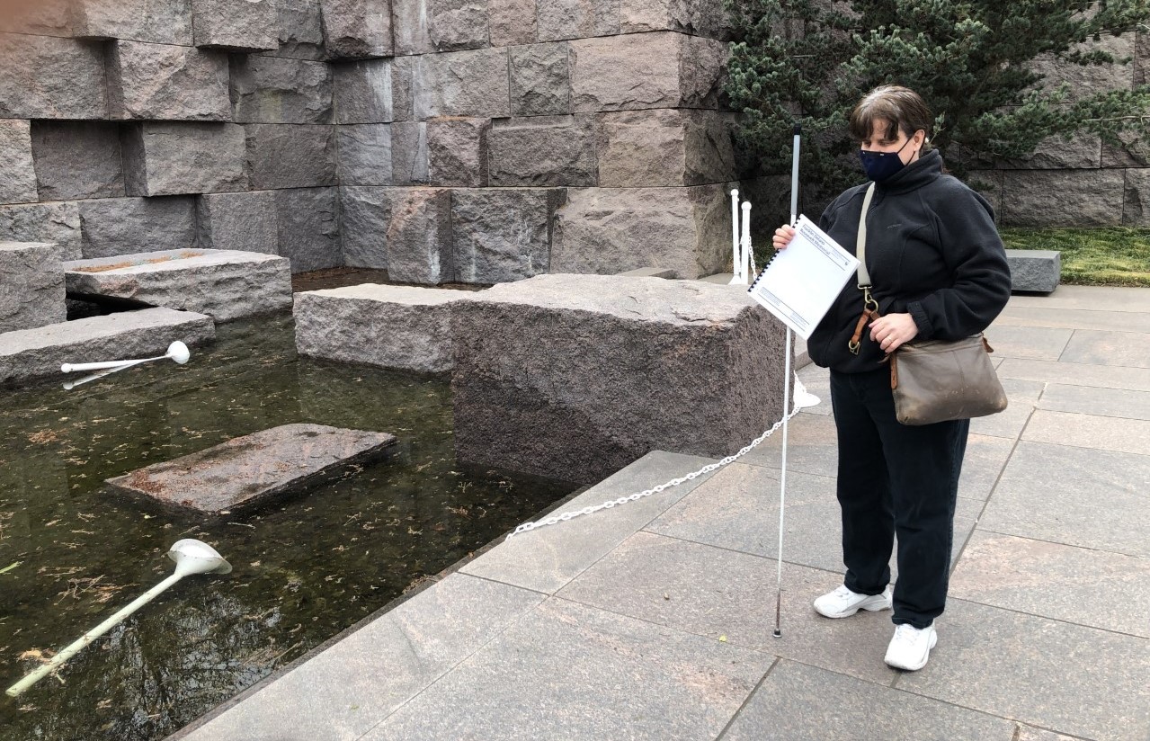 Dr. Cheryl Fogle-Hatch approaching FDR Memorial fountain where stanchions are knocked down. She is approximately 3 feet from falling into water.